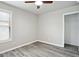 Bedroom with wood-look floors, window and ceiling fan at 2493 Oakleaf Rdg, Lithonia, GA 30058