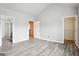 Bedroom with hardwood floors, neutral walls, and white trim provides a versatile space at 2493 Oakleaf Rdg, Lithonia, GA 30058