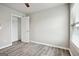 Bedroom with closet and wood-look floors with a light gray color at 2493 Oakleaf Rdg, Lithonia, GA 30058