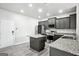 Modern kitchen featuring stainless steel appliances, granite countertops and wood floors at 2493 Oakleaf Rdg, Lithonia, GA 30058