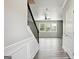 Bright living room featuring stylish wood floors, staircase, and light gray walls at 2493 Oakleaf Rdg, Lithonia, GA 30058