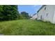 Large backyard needing some maintenance and showing the back of the house at 3679 Seabass Rd, Decatur, GA 30034