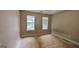 Spacious bedroom with natural light streaming through two windows, ready for personalization at 3679 Seabass Rd, Decatur, GA 30034