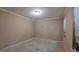 Empty bedroom with beige walls, a single window, and potential for customization at 3679 Seabass Rd, Decatur, GA 30034