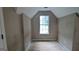 Cozy bedroom with an angled ceiling and ample natural light, awaits personal touches at 3679 Seabass Rd, Decatur, GA 30034
