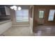Bright dining area with tile flooring and a view of the backyard through the windows at 3679 Seabass Rd, Decatur, GA 30034