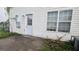 The back door and windows of a home's exterior, with a small patio area at 3679 Seabass Rd, Decatur, GA 30034