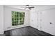 Bedroom with a large window and two closets at 5490 Chemin De Vie, Sandy Springs, GA 30342