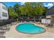 Community pool with many lounge chairs perfect for relaxation and recreation at 5490 Chemin De Vie, Sandy Springs, GA 30342