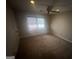 Cozy bedroom with plush carpeting, neutral walls, a ceiling fan, and natural lighting at 120 Creekwood Ln, Fayetteville, GA 30214
