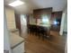 Kitchen with wooden cabinets, granite counters, stainless appliances, and an island with seating at 120 Creekwood Ln, Fayetteville, GA 30214