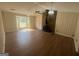 Cozy living room with a stone fireplace, wood burning stove and plenty of natural light at 120 Creekwood Ln, Fayetteville, GA 30214
