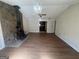 Living room featuring a wood burning stove, hardwood floors, and natural light at 120 Creekwood Ln, Fayetteville, GA 30214