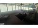 Screened porch with wicker furniture, a ceiling fan, and views of the backyard at 120 Creekwood Ln, Fayetteville, GA 30214