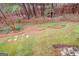 Aerial view of the backyard featuring a wooded area and landscaping at 135 Edgewater Trl, Fayetteville, GA 30215