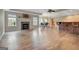 Finished basement features a fireplace, bar, and dining area with laminate flooring at 135 Edgewater Trl, Fayetteville, GA 30215