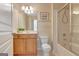 Bathroom with a tub and shower combination, vanity with mirror and light fixture at 135 Edgewater Trl, Fayetteville, GA 30215