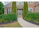 Charming home entrance featuring manicured landscaping and a welcoming front door at 135 Edgewater Trl, Fayetteville, GA 30215