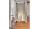 Hallway with wood floors and glass sliding door leading down to the basement at 135 Edgewater Trl, Fayetteville, GA 30215