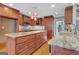 Beautiful kitchen with granite countertops, stainless steel appliances, and custom cabinetry at 135 Edgewater Trl, Fayetteville, GA 30215