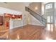 Open-concept living area with hardwood floors and views into the kitchen at 135 Edgewater Trl, Fayetteville, GA 30215