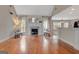 Spacious living room with hardwood floors, fireplace, and plenty of natural light at 135 Edgewater Trl, Fayetteville, GA 30215