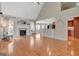 Bright living room featuring a fireplace, hardwood floors, and open-concept design at 135 Edgewater Trl, Fayetteville, GA 30215