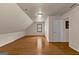 Attic featuring a wood floor and view to a window at 108 Summit Walk, Peachtree City, GA 30269