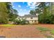 Well-maintained backyard featuring mature trees and a private setting at 108 Summit Walk, Peachtree City, GA 30269