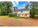 Back of house and new deck with a view to a well maintained backyard at 108 Summit Walk, Peachtree City, GA 30269