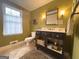 Cozy bathroom with decorative vanity, natural light, and updated fixtures at 108 Summit Walk, Peachtree City, GA 30269