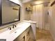 Bathroom featuring a shower, mirror, and cream-colored vanity with a white countertop at 108 Summit Walk, Peachtree City, GA 30269