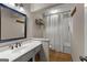 Bathroom featuring a vanity, decorative mirror, and shower at 108 Summit Walk, Peachtree City, GA 30269