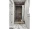 Modern bathroom features tiled shower, glass door, and a bright window at 108 Summit Walk, Peachtree City, GA 30269