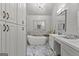 Luxurious bathroom with marble flooring, soaking tub, double vanity, and elegant chandelier at 108 Summit Walk, Peachtree City, GA 30269