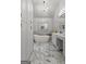 Luxurious bathroom featuring marble floors, soaking tub, double vanity, and chandelier at 108 Summit Walk, Peachtree City, GA 30269
