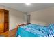 Bedroom with wood floor, paneled door and door to closet at 108 Summit Walk, Peachtree City, GA 30269