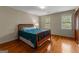 Bedroom with wood floor, paneled door and two windows at 108 Summit Walk, Peachtree City, GA 30269
