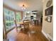 Open-concept dining area adjacent to the kitchen with backyard views at 108 Summit Walk, Peachtree City, GA 30269