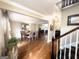 Open concept dining room featuring hardwood flooring and views into the living room at 108 Summit Walk, Peachtree City, GA 30269