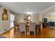 Elegant dining room featuring hardwood floors, crown molding, and a view of the fireplace at 108 Summit Walk, Peachtree City, GA 30269
