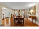 Formal dining room with hardwood floors, wainscoting, and ample natural light at 108 Summit Walk, Peachtree City, GA 30269