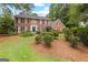 Charming two-story brick home with black shutters and a landscaped front yard at 108 Summit Walk, Peachtree City, GA 30269
