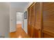 Hallway with wood floor, view to a door to attic and closet at 108 Summit Walk, Peachtree City, GA 30269