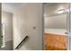 Hallway with wood floor, stair and open door to room at 108 Summit Walk, Peachtree City, GA 30269