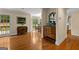 Hallway with hardwood floors leads to dining area with backyard view at 108 Summit Walk, Peachtree City, GA 30269