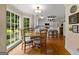 Bright, eat-in kitchen with large bay windows, hardwood floors, and white cabinets at 108 Summit Walk, Peachtree City, GA 30269