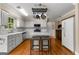 Bright, updated kitchen featuring white cabinets, hardwood floors, and center island at 108 Summit Walk, Peachtree City, GA 30269