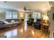 Bright living room featuring hardwood floors, comfortable seating, and an open floor plan at 108 Summit Walk, Peachtree City, GA 30269