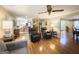 Spacious living room with hardwood floors and comfortable seating leading into the kitchen at 108 Summit Walk, Peachtree City, GA 30269